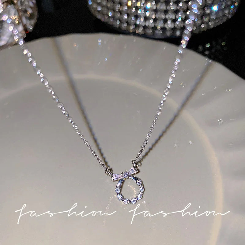 Crystal Bow, Angel Wings & Heart Necklace